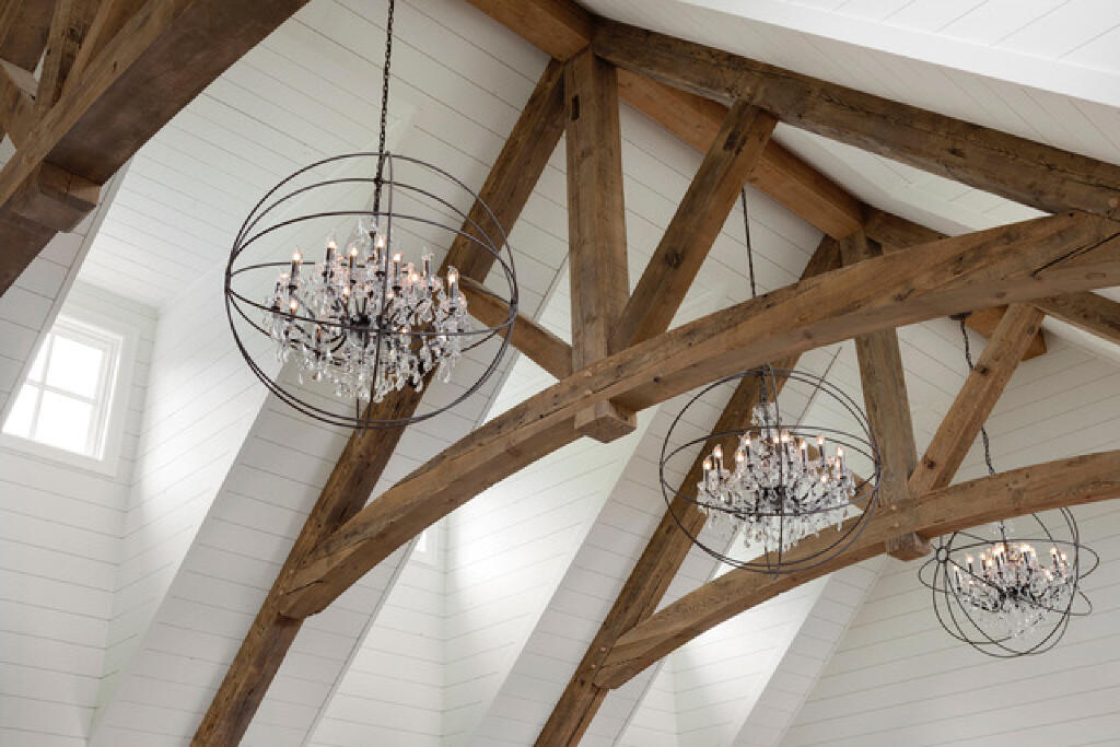 timber vaulted ceiling with dramatic lighting by konen homes